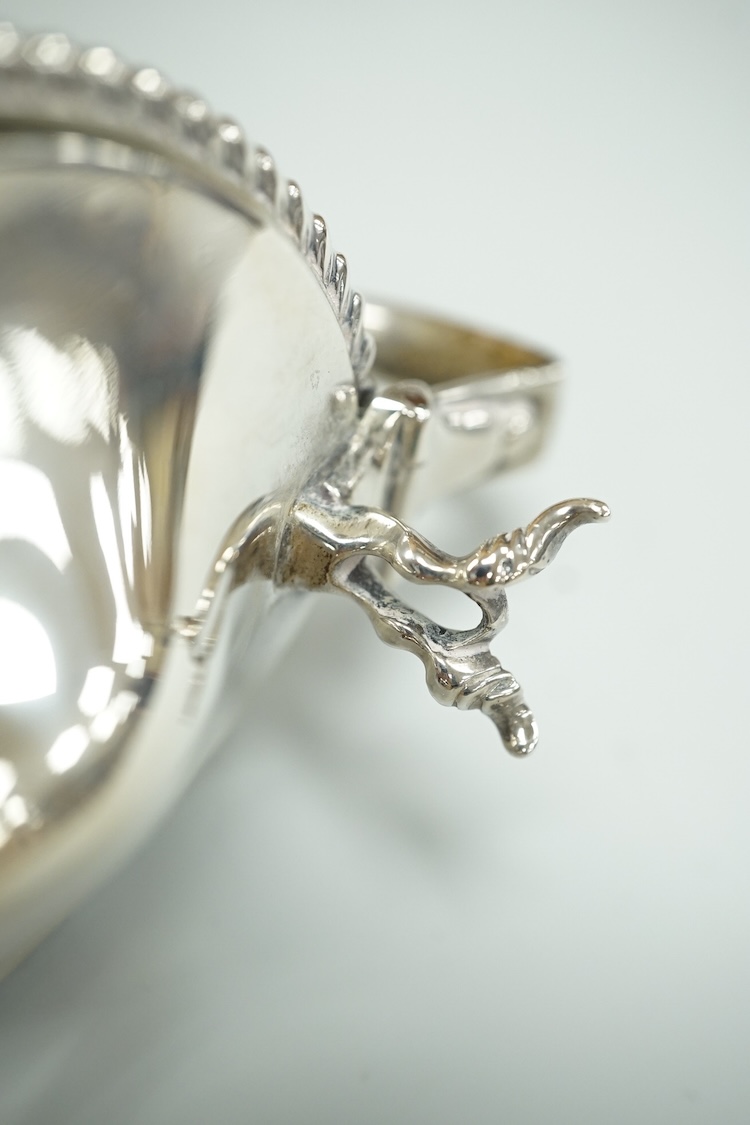 A Victorian silver drum mustard pot, a pair of later silver mustard pots and two silver salts including Victorian.